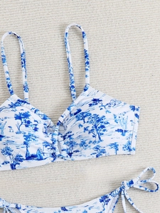 Close-up of Toile de Jouy print and pleated texture on a classic blue and white bikini set