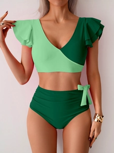 Detail view of high-waist bikini with V-neck layered ruffle sleeves and waist tie decoration