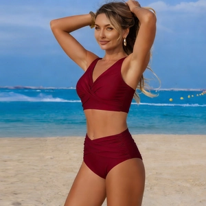 Close-up of wine red two-piece bikini with cross V-neck and high waist pleated bottom