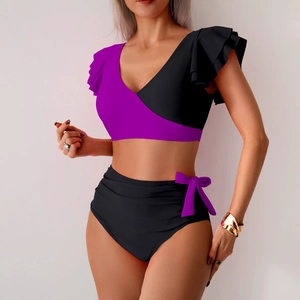 Women's two-piece high-waisted bikini set with purple ruffled top and black bow-tie bottoms
