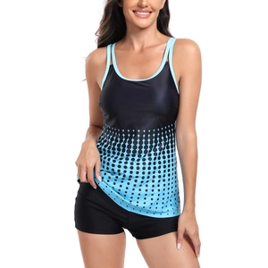 Detail of two-piece tankini with blue polka dot gradient and black boy-short bottom