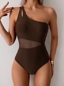 Detail of one-shoulder swimsuit featuring mesh waist panel and cutout shoulder strap