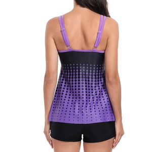 Rear view of purple gradient tankini top with black polka dots and matching swim shorts
