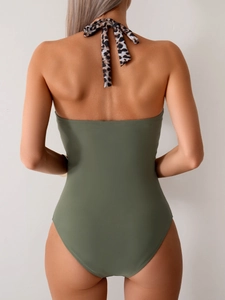 Back view of sexy olive green one-piece swimsuit with leopard print halter neck straps