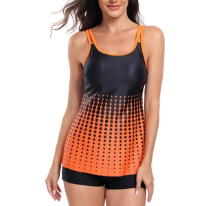 Front view of two-piece tankini set featuring black and orange polka dot gradient pattern