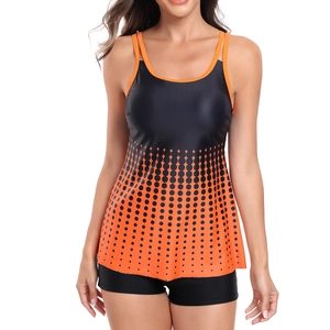 Close-up of black tankini top with orange gradient dots and boyshort bottoms