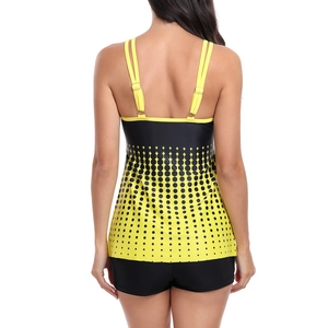 Back view of a two-piece tankini set featuring yellow gradient polka dots and black boyshorts
