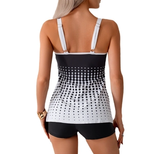 Back view of women's two-piece tankini swimsuit with gradient polka dot print and boy shorts