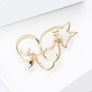 Polished gold alloy fox brooch featuring a hollow minimalist line design on white stand