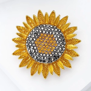 Exquise broche tournesol avec pétales en métal doré et centre en strass cristallins