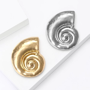 Polished snail shell shaped alloy brooch in gold and silver with hammer texture finish