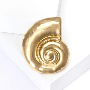 Minimalist golden snail shell brooch with a textured matte metal finish for women