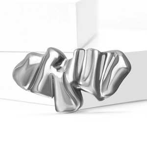 Abstract silver liquid metal wave brooch with a minimalist wrinkled flowing design