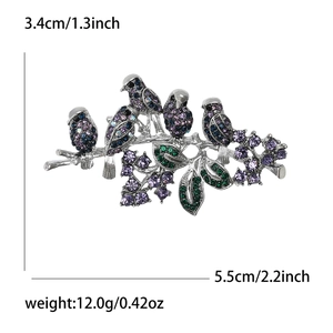 Elegant silver brooch featuring five birds on a branch with colorful crystal accents