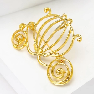 Elegant hollow golden pumpkin carriage brooch pin for women suit accessory with metallic finish
