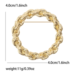 Vintage gold alloy round brooch with twisted rope texture and 4cm diameter dimensions