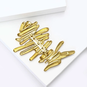 Golden minimalist wavy textured abstract artistic brooch with sleek metallic finish