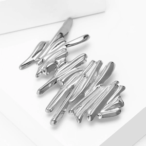 Modern minimalist wave-shaped stainless steel brooch with a liquid metal mirror finish