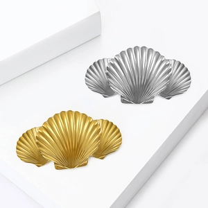 Elegant stainless steel shell brooch pins in gold and silver with wavy texture design