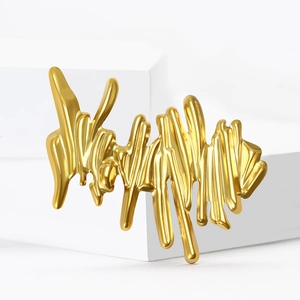Unique gold liquid metal wave brooch pin with abstract minimalist stainless steel design