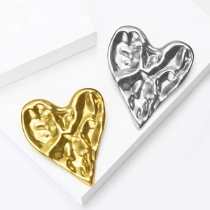 Lava textured heart-shaped stainless steel brooches in gold and silver finish