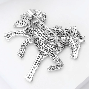 Detailed back view of silver horse brooch showing texture and pin closure mechanism