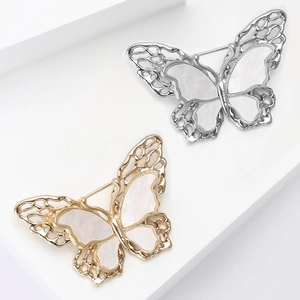Elegant gold and silver double-layered butterfly brooch with iridescent shell inlay