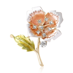 Elegant gold flower brooch with gradient enamel petals and shimmering rhinestone accents