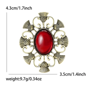 Broche chardon dorée vintage avec pierre rouge ovale montrant les dimensions