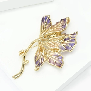 Detailed back view of lotus brooch showing secure pin fastener and gold plating