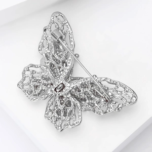 Detail view of the silver butterfly brooch back showing refined mesh hollow craftsmanship