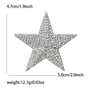 Star-shaped brooch with silver finish and crystal rhinestones, measuring 4.7cm by 5.0cm
