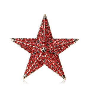 Vintage red star brooch with sparkling crystals and antique gold finish decoration
