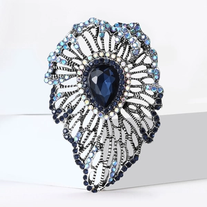 Vintage retro silver brooch with teardrop dark blue crystal and AB colorful rhinestones