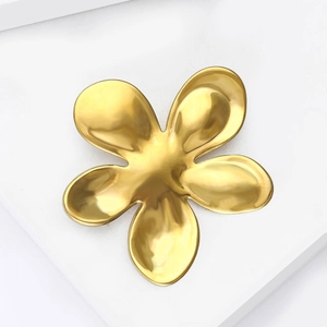 Polished gold liquid metal flower brooch with a minimalist organic petal design