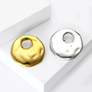 Modern liquid metal hollow circular brooch pins in gold and silver with lava texture