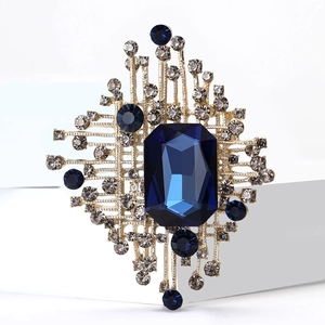 Elegante spilla geometrica dorata con cristallo blu e strass brillanti di lusso