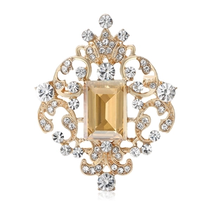 Exquisite vintage royal style brooch with amber crystal and gold filigree setting