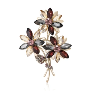 Luxurious bouquet brooch with gray purple crystals and sparkling rhinestones on golden alloy