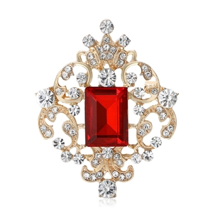 Exquisite vintage style brooch with rectangular red gem and golden hollow floral pattern