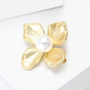 Elegant gold flower brooch with single white pearl and brushed metal petals for women
