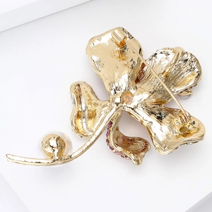 Detailed back view of hibiscus pearl brooch showing gold plating and secure pin closure
