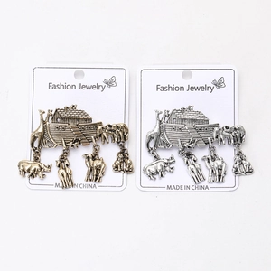 Detailed macro view of vintage Noah's Ark animal charms in antique bronze and silver