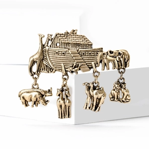 Vintage gold Noah's Ark brooch with hanging animal charms on geometric stands