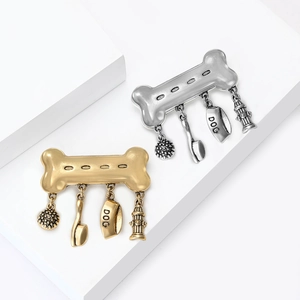 Vintage bone brooch with pet pendants in gold and antique silver finishes