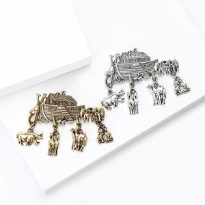 Vintage Noah's Ark brooch in gold and silver finish with hanging animal charms for suits