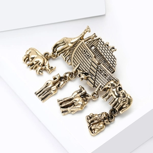 Vintage gold Noah's Ark brooch with hanging animal charms like lion and elephant