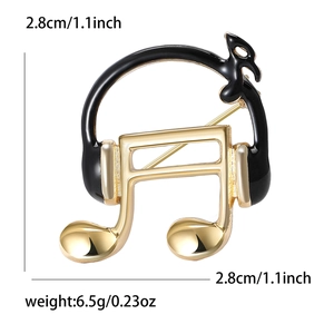 Detail view of musical note and headphone brooch with 2.8cm size and 6.5g weight info