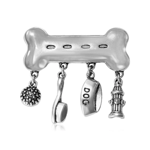 Retro silver alloy dog bone brooch with comb, bowl and hydrant pendants on white background