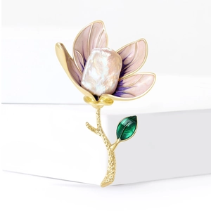Elegant magnolia flower brooch with purple shell petals and golden metal details